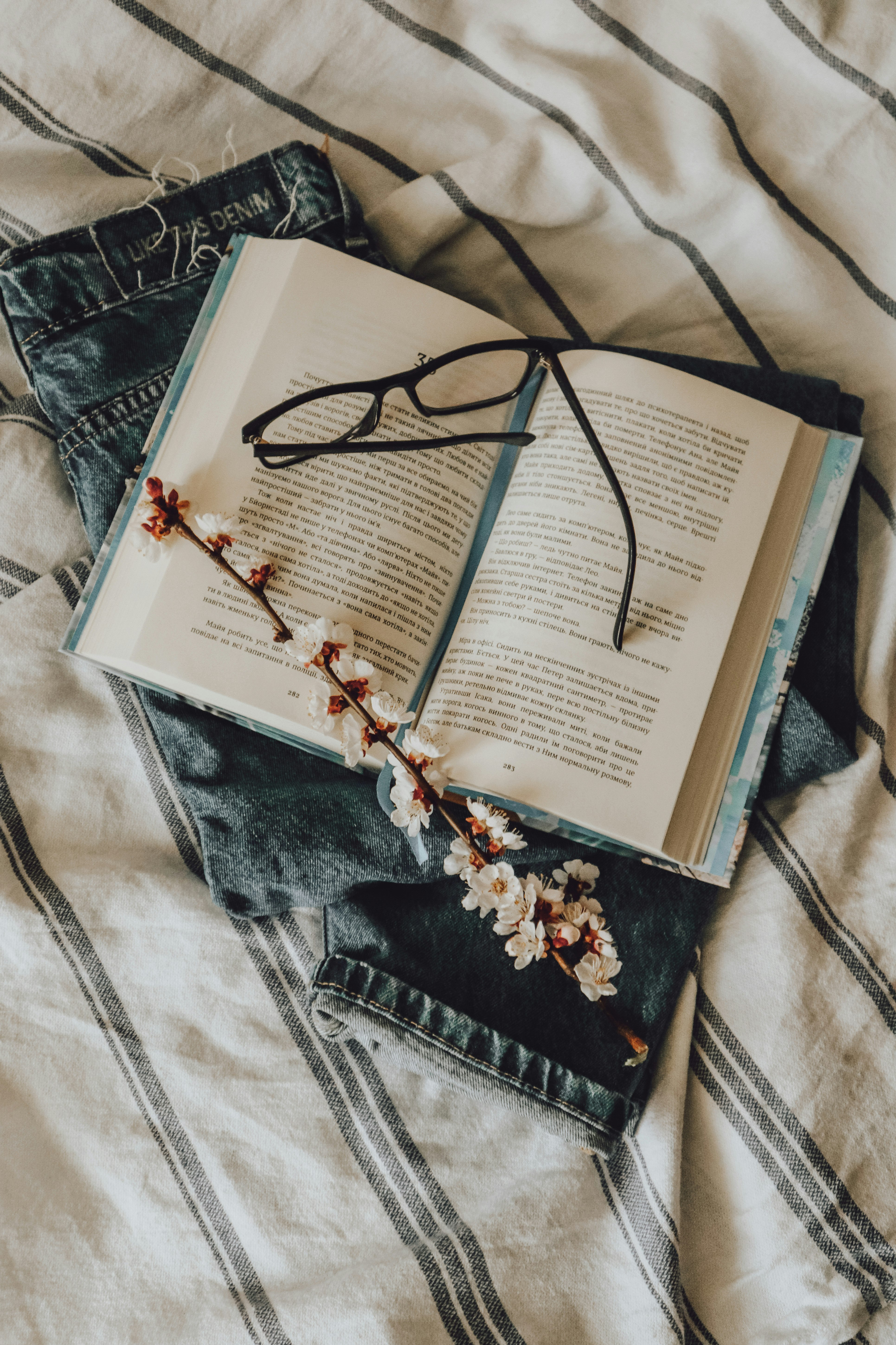 black framed eyeglasses on book page